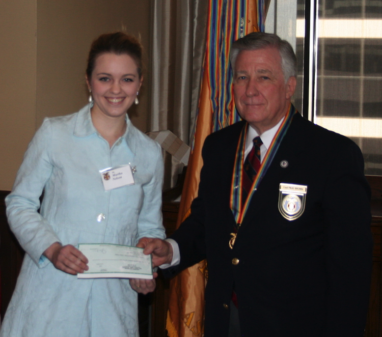 HERED Companion Martha Nelson Presenting $2,500 Grant Check for YLC Program